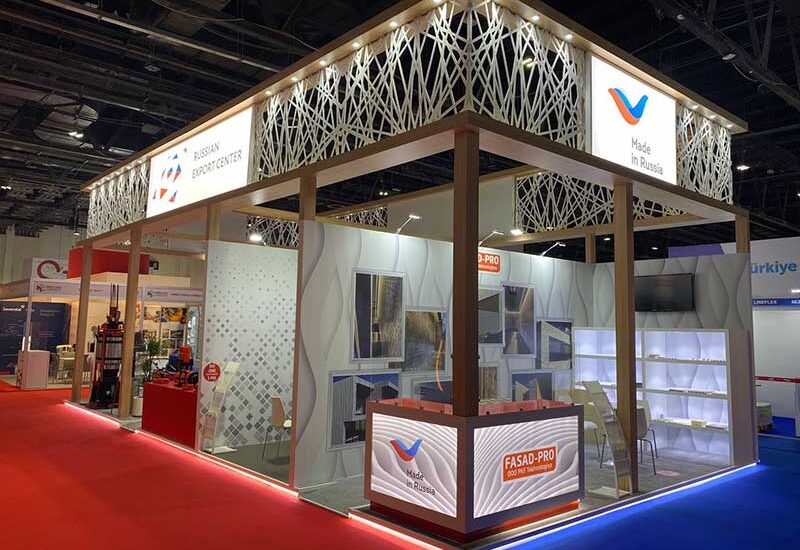 An exhibition stand showcasing Russian-made workwear and equipment at a trade show in Dubai