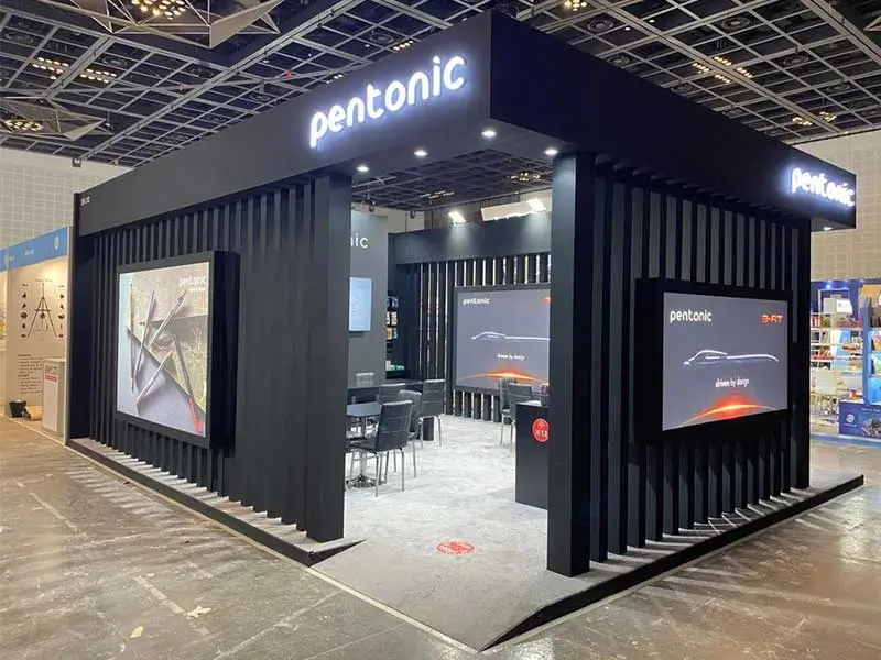An exhibition booth with modern design and interactive screens at a trade show in 2025, created by PKO, a leading exhibition stand builder in UAE.